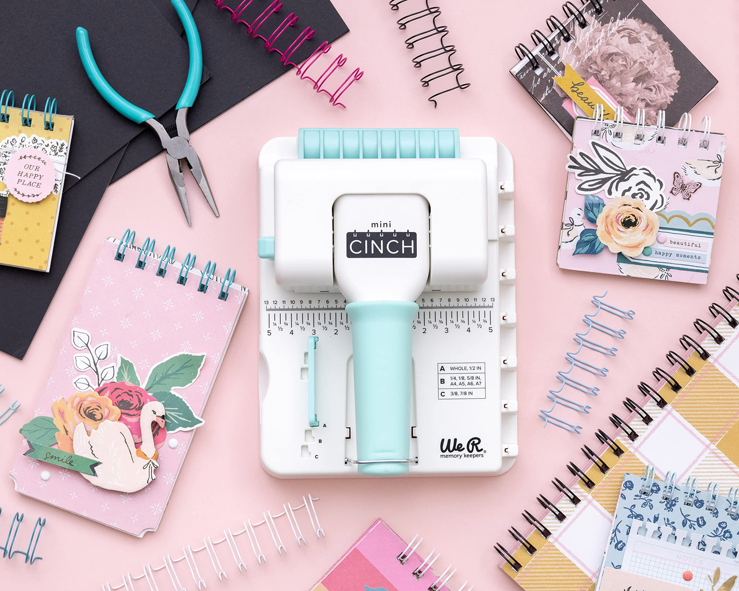 We R Memory Keepers Mini Cinch Bundle Includes Book Binding Machine, 16 Wires, Wire Cutters, and Six Black Bookboards, Easy to Use Design, Ruler, Wire or Spiral Coils, DIY Books, Notebooks, Calendars