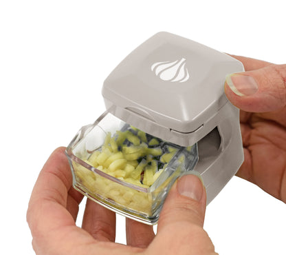 Kitchen Innovations Garlic-A-Peel Garlic Press, Crusher, Cutter, Mincer, and Storage Container - Includes Silicone Garlic Peeler - Easy to Clean - Stainless Steel Blades – (Cream), standard