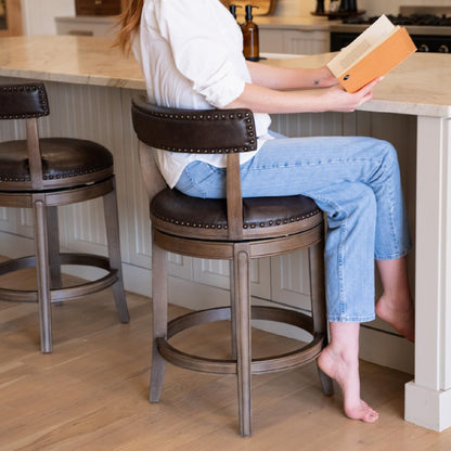Maven Lane Alexander Counter Stool 26 Inches – Swivel Stool with Footrest – Brown Solid Wood and Brown Faux Leather Upholstery – Perfect for Kitchen Island and Counter