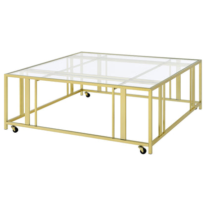 Coaster Home Furnishings - Adri - Square Glass Top Coffee Table with Geometric Base and Mobile with Rolling Casters - Contemporary - Living Room - Matte Brass - 710188