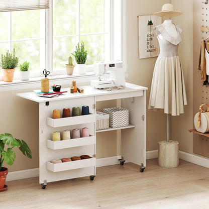 Giantex Folding Sewing Table with Charging Station, Rolling Craft Table with Storage Trays & Shelf, Foldable Sewing Machine Cabinet Desk with Lockable Wheels for Small Spaces (White)