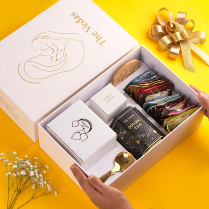 The Vedas Gift For MOM | Mothers day gift | 22 items teagift | 8 Different Flavours teabags | 1 Luxury Oolong tea tin Caddy | total 56 Cups of tea | 1 Glass Mug for MOM With lid and Infuser | 1 Scented Candle | 1 Branded Spoon | 1 Wooden Coaster