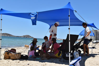 Shade Eco Nomad XL Beach Shade Tent with Shoulder Bag - Easy Setup UPF50+ Portable Sunshade Canopy for Sand or Grass, Wind Resistant - Summer Vacation Essentials - Plus Dry Bag - 15x8.5 ft, 4-Posts
