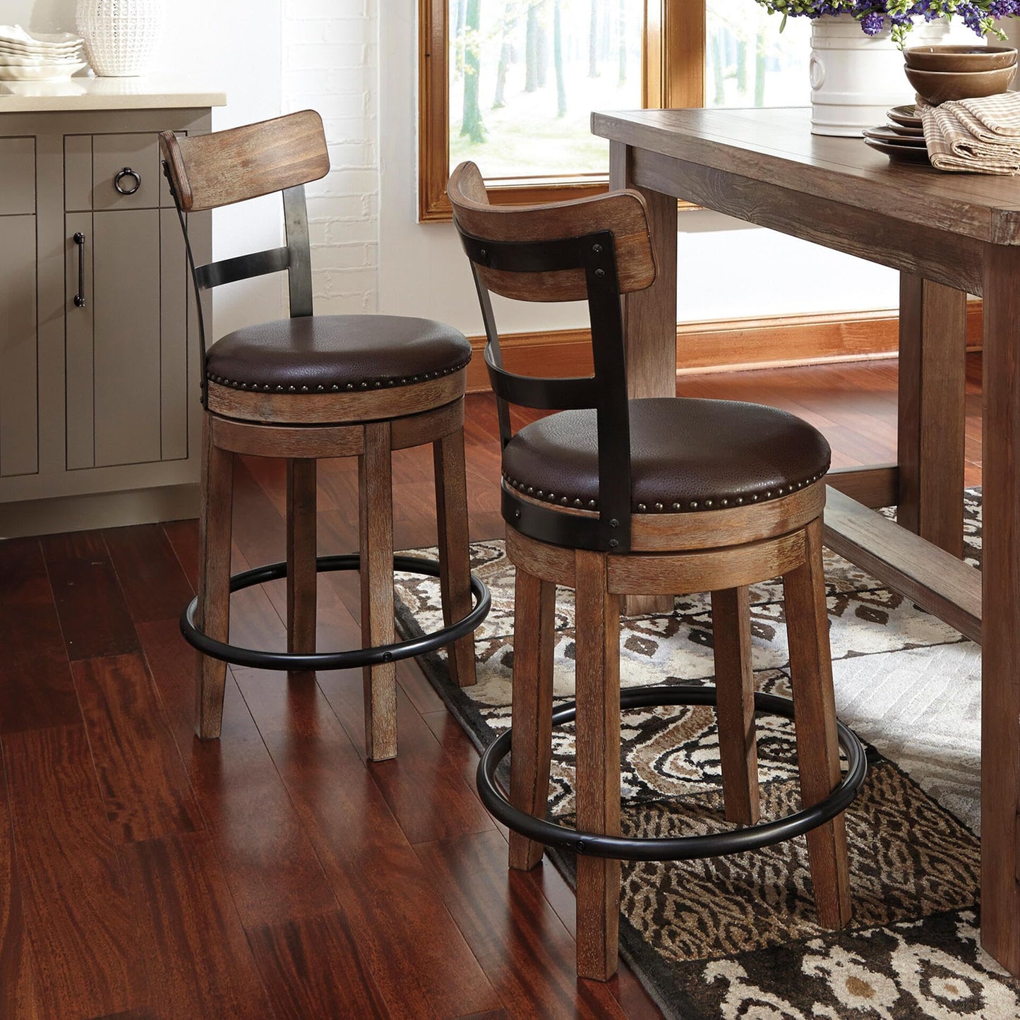 Signature Design by Ashley Pinnadel Bar Stool, Swivel Counter Height Stool Chair With Faux Leather Seat, Wood and Metal Frame for Kitchen Island With Seating, Light Brown