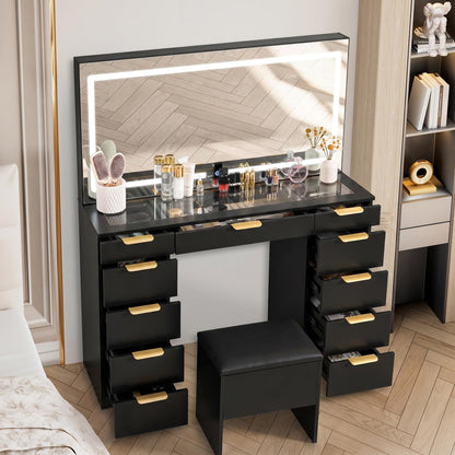 Fkhouse Glass Top Vanity Desk with Mirror and Lights, 11 Drawers Makeup Vanity with Stool, 3 Lighting Modes Dressing Table with Power Outlet, Golden Handles, Black