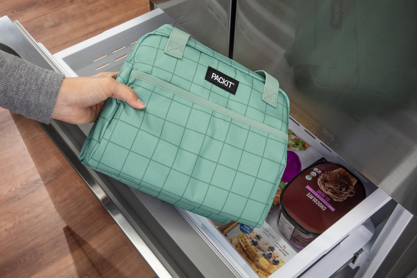 PackIt®️ Freezable Hampton Lunch Bag, Sports Grid Sage, Built with ECOFREEZE® Technology, Collapsible, Reusable, Zip Closure with Front Pocket and Shoulder Straps, Designed for Fresh Office Lunches