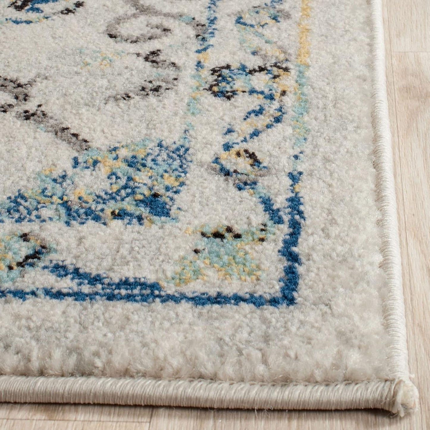SAFAVIEH Evoke Collection Accent Rug (2'2" x 4', Ivory & Blue, Boho Design, Non-Shedding, Easy Care)