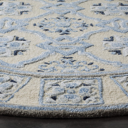 SAFAVIEH Bella Collection Area Rug - 7' Square, Ivory & Blue, Handmade Wool & Viscose, Ideal for High Traffic Areas in Living Room, Bedroom (BEL155A)