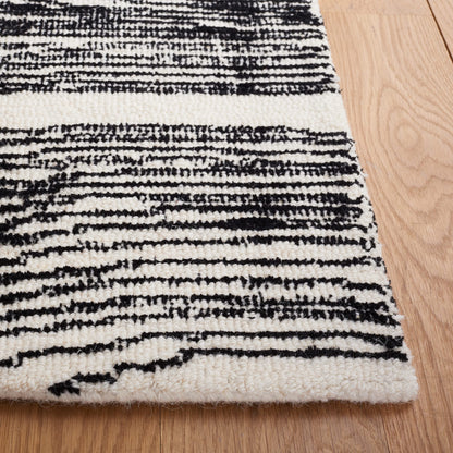 SAFAVIEH Area Rug 8x10 - Metro Collection - Large - Black & Ivory, Handmade Wool, Ideal for Living Room, Bedroom, Office, Dining Space (MET995Z)