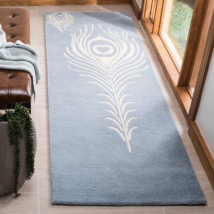 SAFAVIEH Soho Collection 7'6" x 9'6" Teal / Ivory SOH704T Handmade Premium Wool & Viscose Area Rug