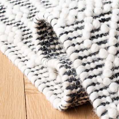 SAFAVIEH Natura Collection Area Rug - 9' x 12', Ivory & Black, Handmade Moroccan Boho Wool Fringe, Ideal for High Traffic Areas in Living Room, Bedroom (NAT852Z)