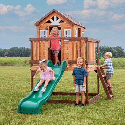 Backyard Discovery Echo Heights Elevated Cedar Wooden Kids Playhouse with Wave Slide, Play Kitchen, Wrap-Around Deck, Flat-Step Ladder, Half Door, Windows, Bell, and Growth Chart for Outdoor Play