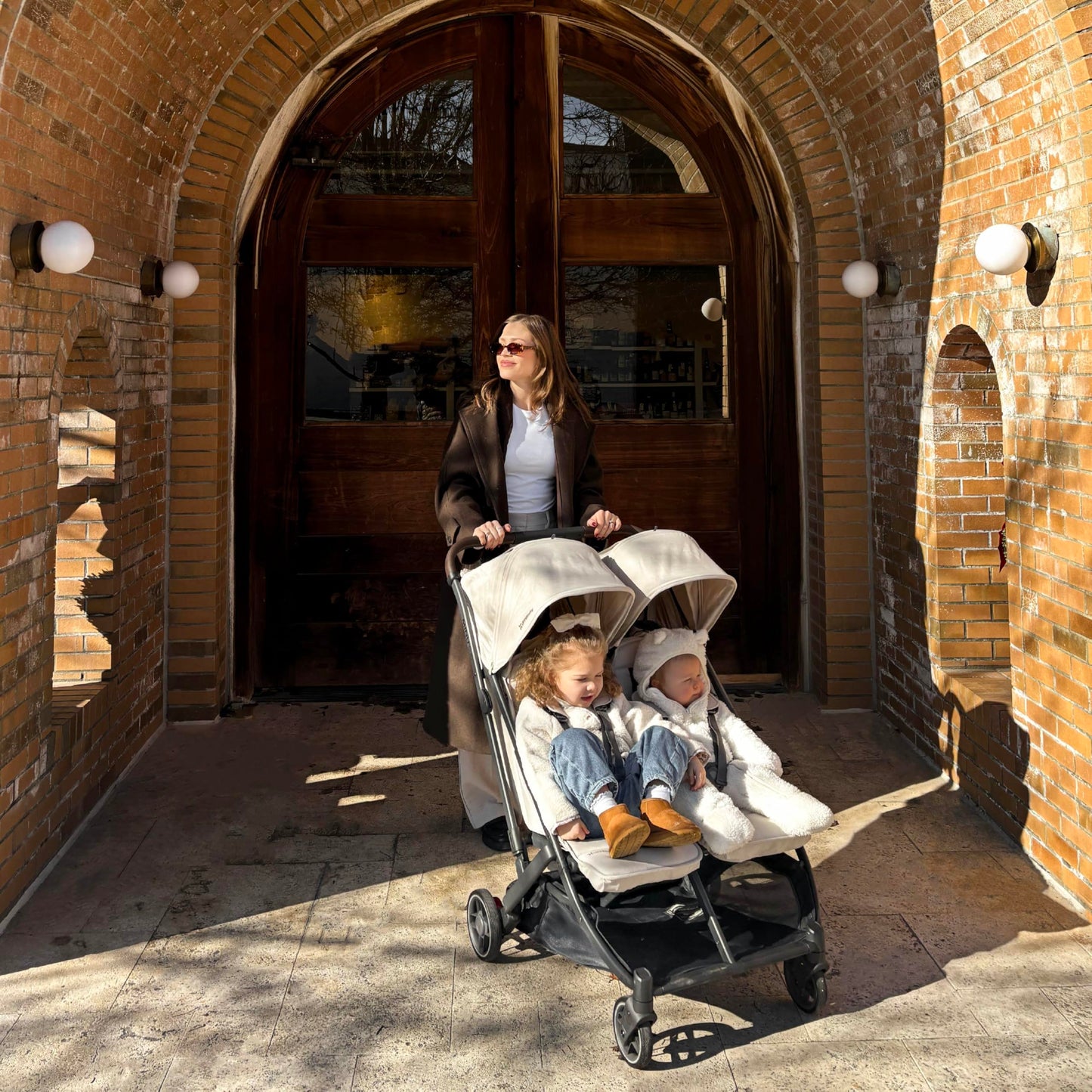 UPPAbaby Minu Duo Side-by-Side Double Stroller - Lightweight + Compact Design for Travel - Easy Fold- from Birth to Toddler - Independent Recline -Ada (Sandstone/Carbon Frame/Chestnut Leather)