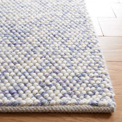 SAFAVIEH Natura Collection Area Rug - 6' x 9', Blue & Ivory, Handmade Wool, Ideal for High Traffic Areas in Living Room, Bedroom (NAT182M)