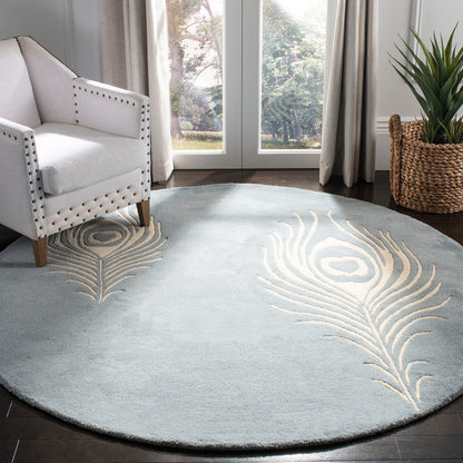 SAFAVIEH Soho Collection 7'6" x 9'6" Teal / Ivory SOH704T Handmade Premium Wool & Viscose Area Rug