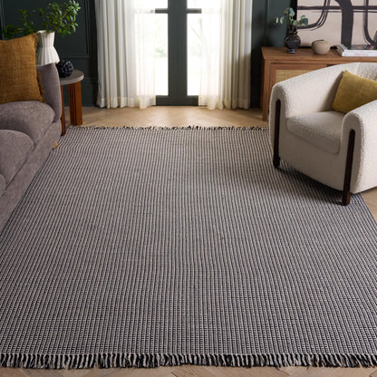 SAFAVIEH Montauk Collection Area Rug - 9' x 12', Ivory & Black, Handmade Flat Weave Boho Farmhouse Cotton Tassel Fringe, Ideal for High Traffic Areas in Living Room, Bedroom (MTK340D)